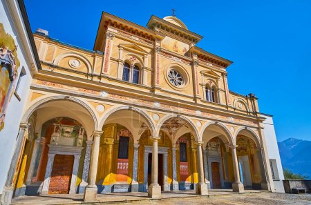The porticoed frescoed facade of historic Santa Maria Assunta Church of Madonna del Sasso Sanctuary, Sacro Monte, Orselina, Switzerland