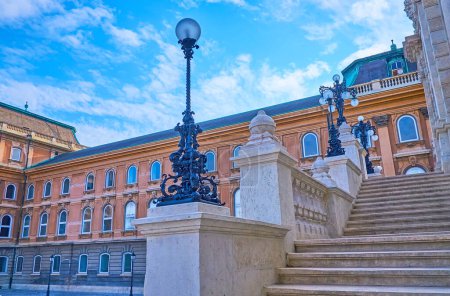Photo for The white stone stairway to Habsburg Gates of Buda Castle, decorated with carved details and vintage cast iron streetlights, Budapest, Hungary - Royalty Free Image