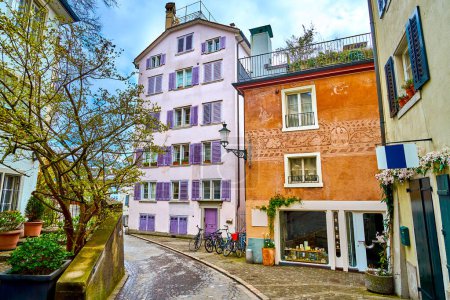 Scenic residential houses on the narrow street in Schepfe district of old town in Zurich, Switzerland
