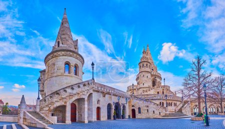 The stone towers of Fisherman's Bastion in Budapest, Hungary, evoke a fairy tale-like charm as they overlook Holy Trinity Square in the Buda Castle Quarter