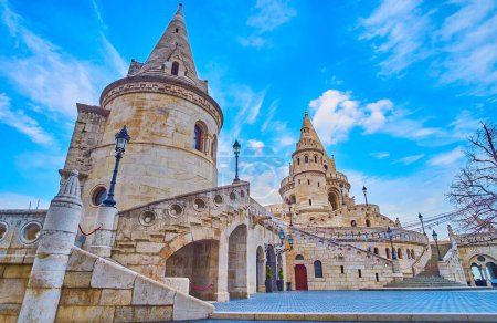 The carved walls and towers of the Fisherman's Bastion, the famous landmark of Buda Castle Quarter, Budapest, Hungary,