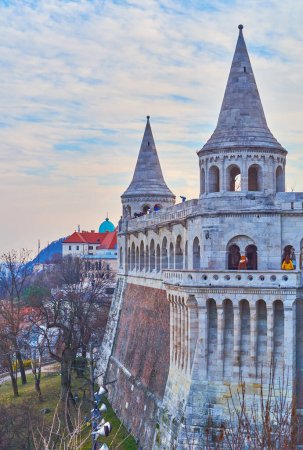 The carved stone Fisherman's Bastion against the purple sunset sky, Budapest, Hungary
