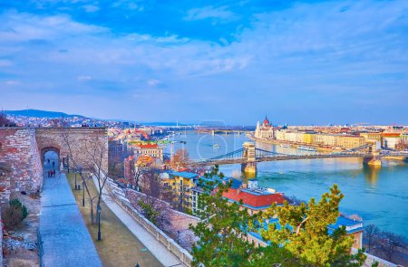 The cityscape of Budapest from the ramparts of Buda Castle, overlooking Danube, Szechenyi Chain Bridge, Parliament and Margaret Bridge, Hungary