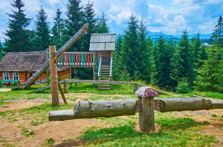 The folk style playground with traditional wooden seesaw in Mountain Valley Peppers, Carpathians, Ukraine