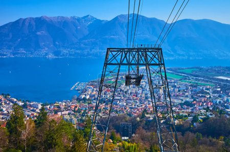 The outstanding views of Locarno, Lake Maggiore and mountains from the riding Cardada Cimetta cable car, Switzerland