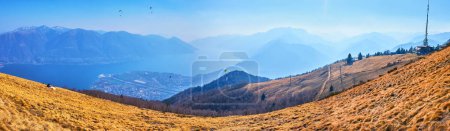 Panorama of the dried up yellow montane meadow with Alpine Tundra vegetation on Cardada Cimetta slope, Ticino, Switzerland