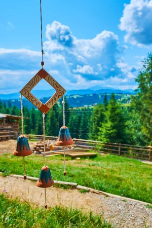 The handmade clay wind chimes against the mountains, Mountain Valley Peppers handicraft village, Ukraine