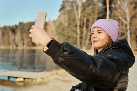 Photo for Caucasian woman making selfie  outdoors in the winter - Royalty Free Image