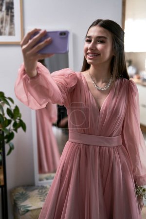 Young girl make selfie before prom