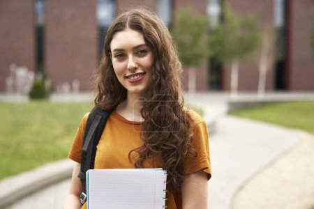 Photo for Portrait of caucasian university student standing outside the university campus - Royalty Free Image