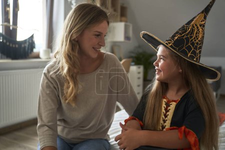 Photo for Caucasian mother and daughter bearing Halloween party costume - Royalty Free Image