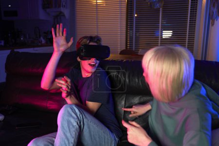 Photo for Young caucasian couple having fun while using VR glasses - Royalty Free Image