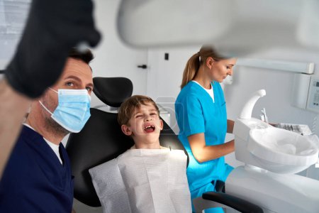 Little boy having visit at dentist's office