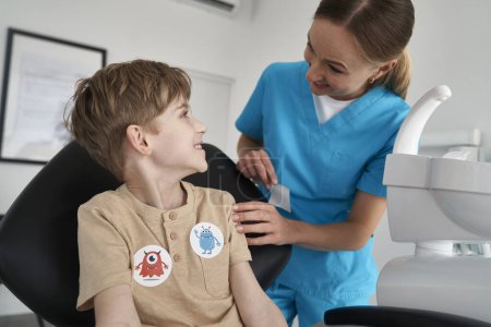 Photo for Little boy having stickers after the dentist's appointment - Royalty Free Image