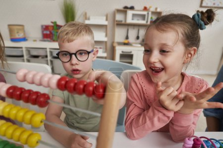 Preschool children using abacus to learn 