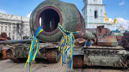 Photo for Destroyed Russian weapons in Ukrainian flag ribbons - Royalty Free Image