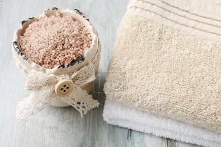 Photo for A bowl with sea salt and two towels.  Spa time - Royalty Free Image