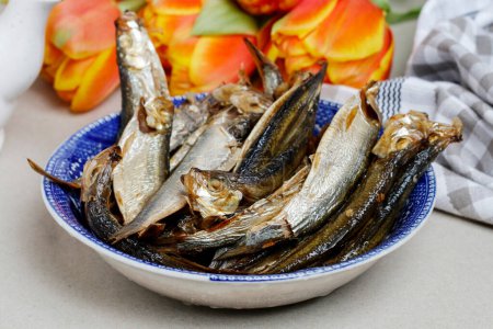 Photo for Smoked sprats in a bowl. Party and festive dish - Royalty Free Image
