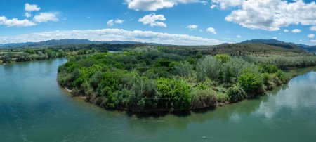 Panoramic view of the Ebro River as it passes through Miravet, Catalonia. Spain