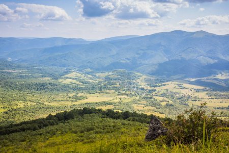 Photo for Beautiful view from the Ukrainian Polonynian Beskids to the mountains and valleys. Rocky peaks of the Ukrainian Carpathians in summer. Water-making ridge in the Carpathians, Carpathian mountains - Royalty Free Image