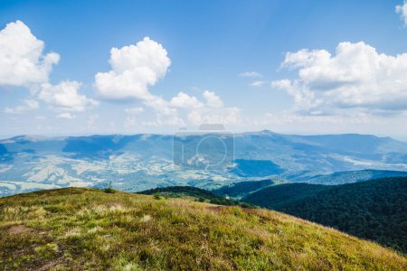 Photo for Beautiful view of the Ukrainian Carpathians to the mountains and valleys. Rocky peaks and wood of the Carpathians in late summer. Yellow and green grass, and the top of the mountain and the path to it - Royalty Free Image