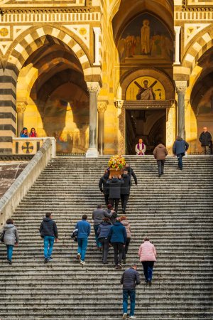 Photo for Amalfi, Italy - 26th Dec 2022: Pallbearers carrying casket up the steps at Amalfi Cathedral - Royalty Free Image