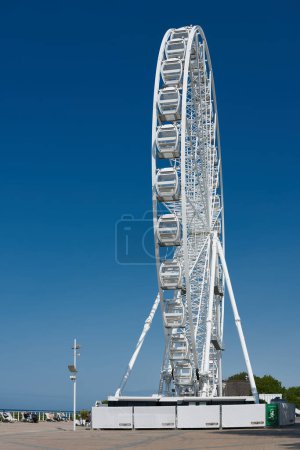 Photo for Ferris wheel as an attraction on the promenade of Kuehlungsborn on the German Baltic Sea coast - Royalty Free Image