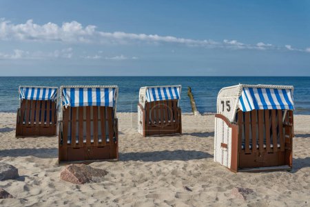 Photo for Beach chairs on the beach of Khlungsborn on the German Baltic Sea coast in sunny summer weather - Royalty Free Image