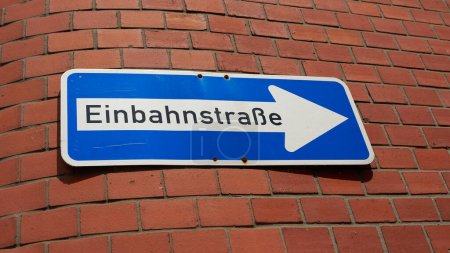 Photo for Traffic sign with German inscription Einbahnstrae on the facade of a house in Wismar in Germany. Translation: one-way street - Royalty Free Image