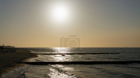 Photo for Beach on the German Baltic Sea coast near Kuehlungsborn with sun and back light - Royalty Free Image