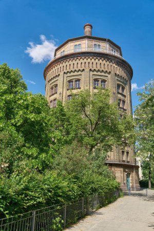 Photo for The oldest water tower, Wasserturm, dicker Hermann in the city of Berlin dating from 1877, today with sought-after apartments in the Prenzlauer Berg district - Royalty Free Image