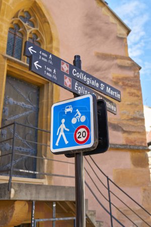  Road sign and signpost to places of interest in the old town of Colmar in France                              