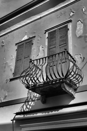 Black and white image of a historic balcony on a facade in the old town of Malcesine on Lake Garda in Italy                               
