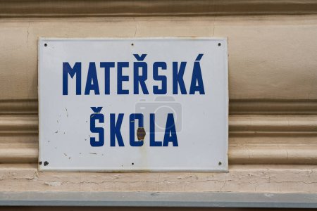   Sign with the Czech inscription Materska Skola in the city center of Prague. Translation: nursery school, preschool                              