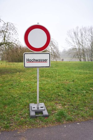  Sign with the German inscription Hochwasser during a flood in Magdeburg in Germany in January 2024. Translation: High water                              