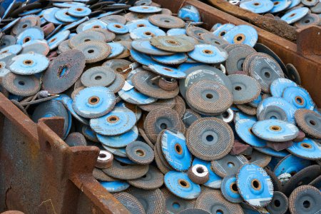 Photo for Magdeburg, Germany  January 31, 2024: Worn, disused cutting-off wheels for metalworking on the site of an abandoned factory in Magdeburg - Royalty Free Image
