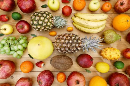 Photo for Fruits on a background of wood and boards - Royalty Free Image