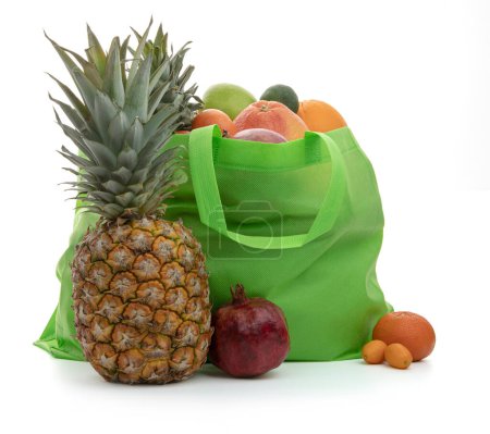 Photo for Fresh fruits in a grocery green canvas bag - Royalty Free Image
