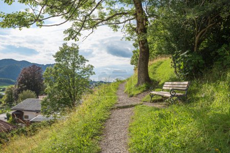beautiful bench beside footpath up to Weinberg hill, Schliersee tourist resort, upper bavarian landscape