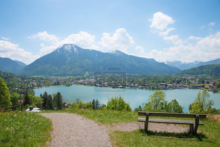 recreational place with bench, above lake tegernsee, view to Rottach-Egern and wallberg mountain, upper bavarian landscape