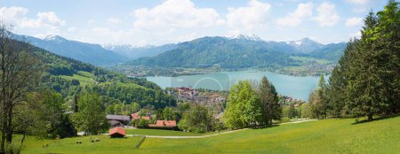stunning panorama spring landscape upper bavaria, view from Neureuth hiking trail. lake Tegernsee and bavarian alps