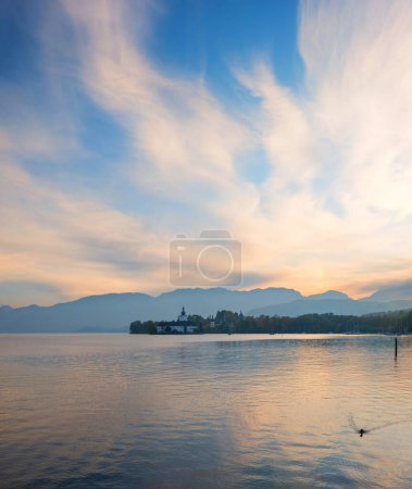 evening mood at lake Traunsee, Salzkammergut, austrian landscape. view to ort castle on peninsula