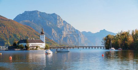 lake Traunsee and Ort castle with footbridge to the island, austrian landscape Gmunden, Salzkammergut