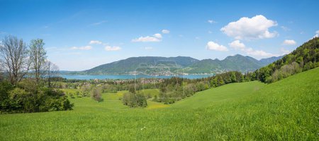 lookout place above Kleinbuch, panorama spring landscape upper bavaria, view to lake tegernsee. blue sky with copy space