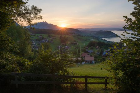 view from lookout point above tourist resort Krattigen, lake Thunersee at sunset. landscape switzerland, Bernese Oberland