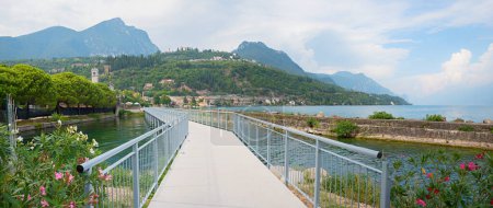 new pedestrian walkway and bike route Ciclopista del Garda with bridge, along the lakeside Gardasee, Toscolano landscape, north italy