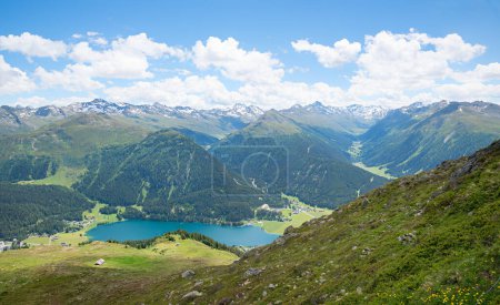 view from Parsenn hiking trail to lake Davoser See and Rhaetian alps, switzerland