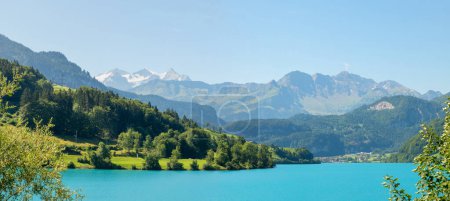 view to the Bernese Alps from turquoise lake Lungernsee, canton Obwalden
