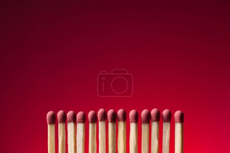 Photo for Set of matches form an orderly row. Conclave concept. - Royalty Free Image