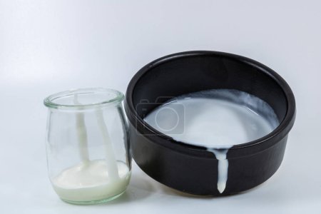 Photo for Dairy products in a glass and ceramic containers - Royalty Free Image